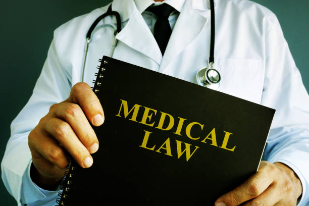 Doctor is holding medical law.